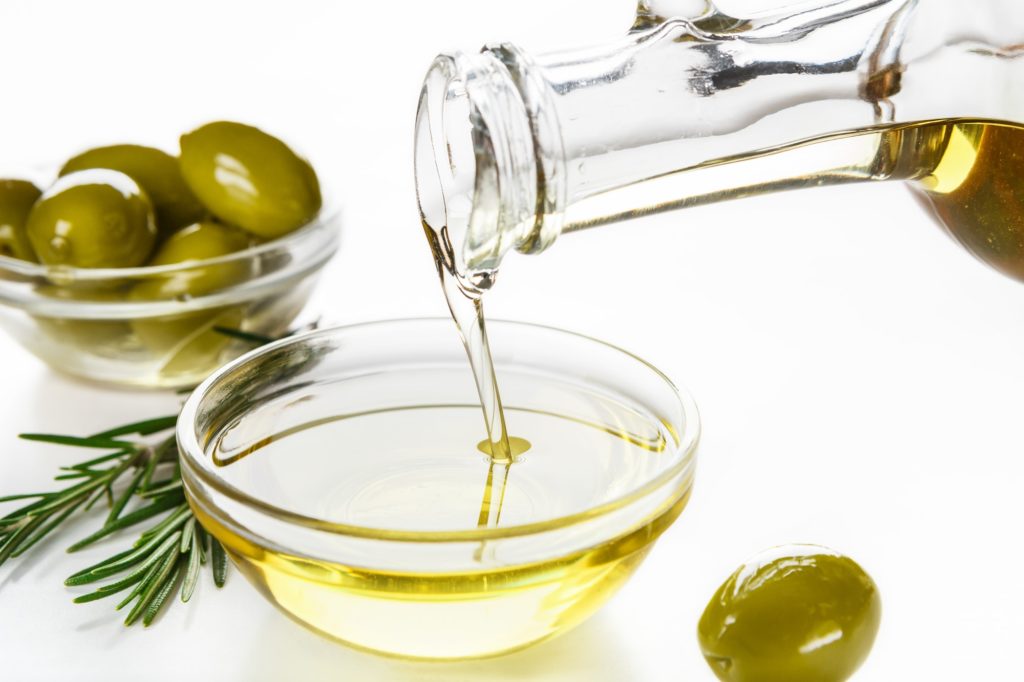 Olive oil and olives in bowls